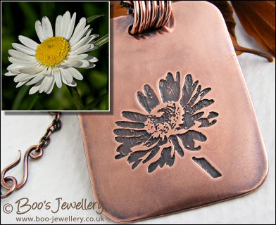 Etched daisy pendant in antiqued copper