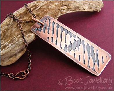 Abstract design etched copper pendant on chain