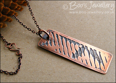 Abstract design etched copper pendant on chain