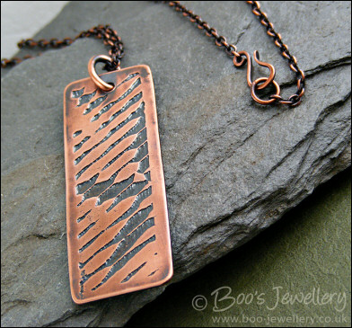 Abstract design etched copper pendant on chain