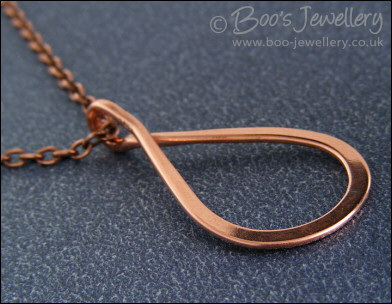 Polished copper teardrop loop pendant
