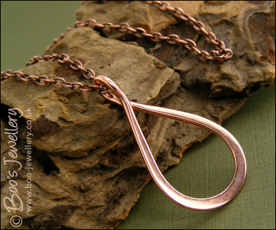 Polished copper teardrop loop pendant