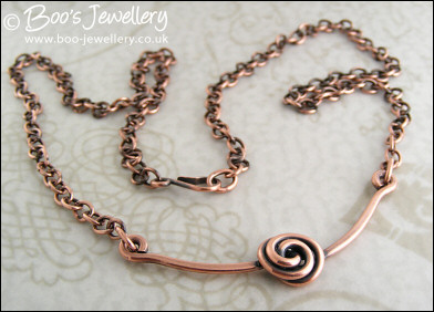 Rosebud knot antiqued copper necklace