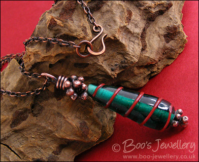Antiqued copper and green glass pendant