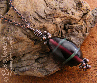 Aubergine and green glass pendant with molten buds