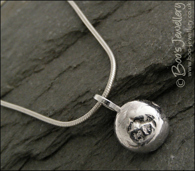 Silver molten pebble pendant