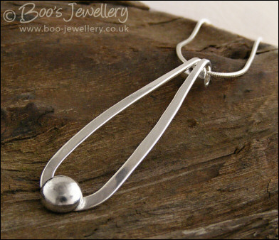 Sterling silver teardrop pendant with pebble of silver