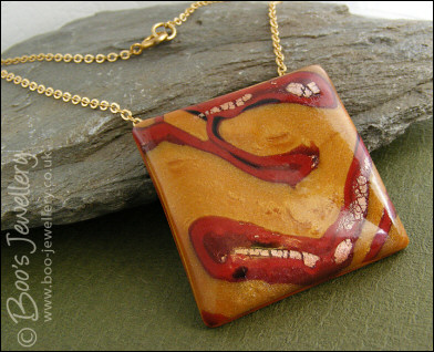 Polymer clay gold and red square pendant