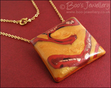 Polymer clay gold and red square pendant