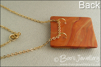 Polymer clay gold and red square pendant