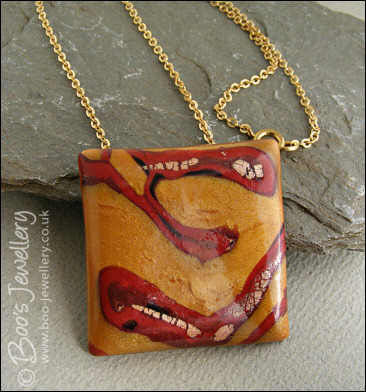 Polymer clay gold and red square pendant
