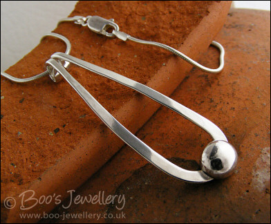 Sterling silver teardrop pendant with pebble of silver