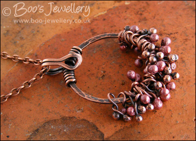 Antiqued copper circle pendant with molten copper buds