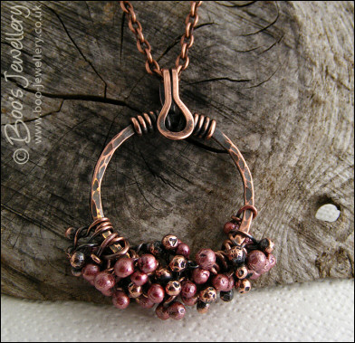 Antiqued copper circle pendant with molten copper buds