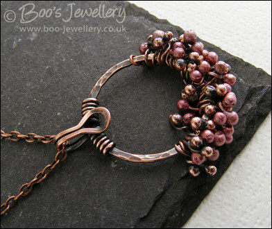 Antiqued copper circle pendant with molten copper buds