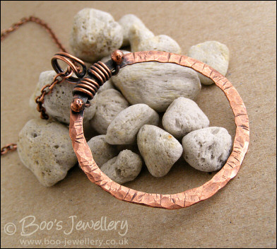 Distressed texture copper circle pendant with tendril bail