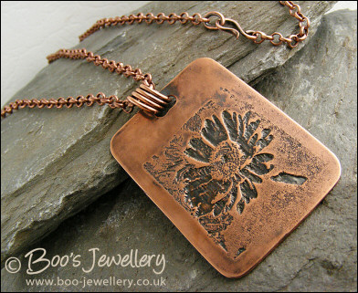 Antiqued copper etched daisy pendant