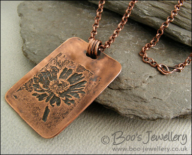 Antiqued copper etched daisy pendant