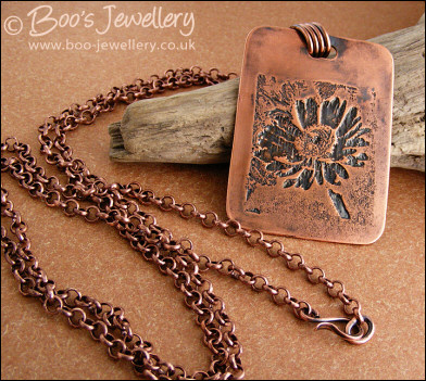 Antiqued copper etched daisy pendant