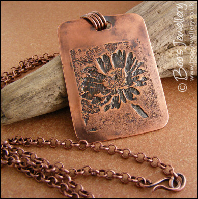 Antiqued copper etched daisy pendant