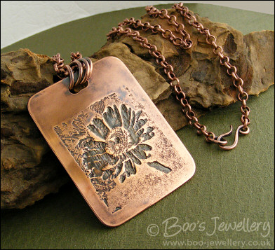 Antiqued copper etched daisy pendant