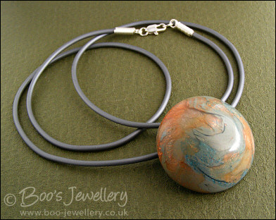 Polymer clay dome shaped pendant on PVC thong necklace