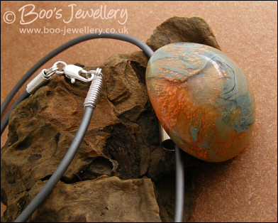 Polymer clay dome shaped pendant on PVC thong necklace