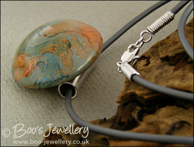Polymer clay dome shaped pendant on PVC thong necklace