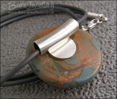 Polymer clay dome shaped pendant on PVC thong necklace