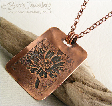 Antiqued copper etched daisy pendant