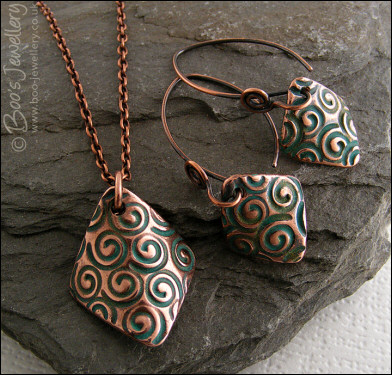 Necklace and earring set  with copper charms impressed with turquoise spirals