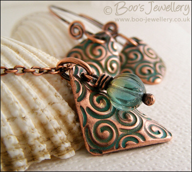 Necklace and earring set  with copper charms impressed with turquoise spirals