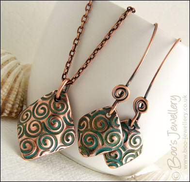 Necklace and earring set  with copper charms impressed with turquoise spirals