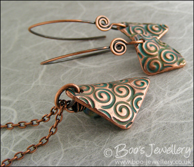 Necklace and earring set  with copper charms impressed with turquoise spirals