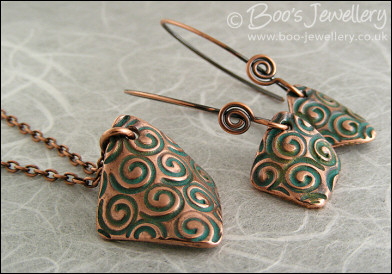Necklace and earring set  with copper charms impressed with turquoise spirals