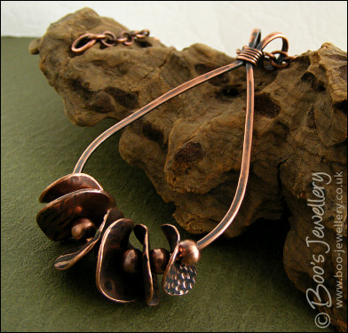 Teardrop loop pendant with textured copper washers