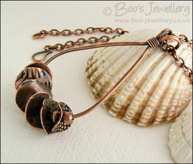 Teardrop loop pendant with textured copper washers