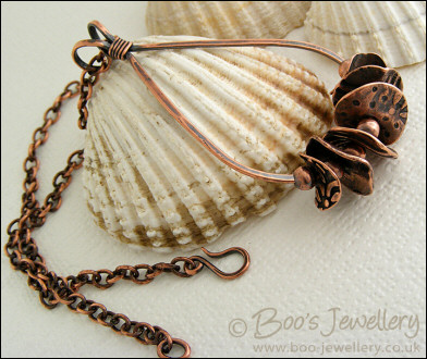 Teardrop loop pendant with textured copper washers