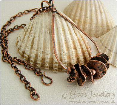 Teardrop loop pendant with textured copper washers