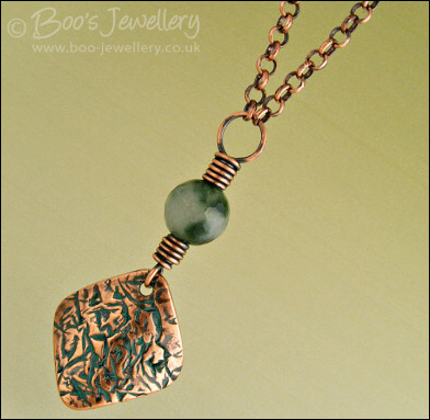 Copper and green jade necklace and earring set with crackled charms
