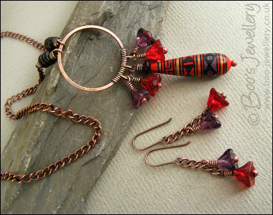 Purple and red necklace and earring set with hand made ceramic bead