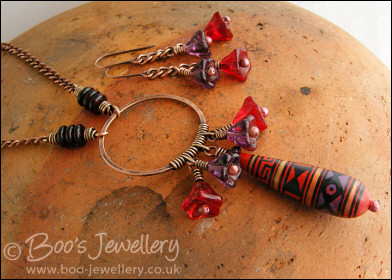 Purple and red necklace and earring set with hand made ceramic bead