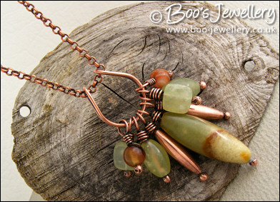 Jade bead cluster and horseshoe loop pendant on chain