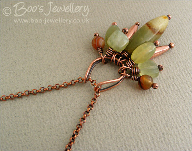 Jade bead cluster and horseshoe loop pendant on chain