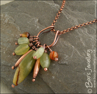 Jade bead cluster and horseshoe loop pendant on chain