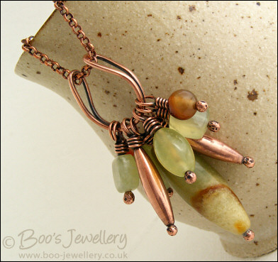 Jade bead cluster and horseshoe loop pendant on chain