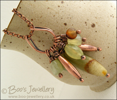 Jade bead cluster and horseshoe loop pendant on chain