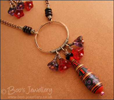 Purple and red necklace and earring set with hand made ceramic bead