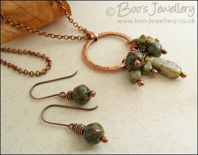 Necklace and earring set featuring a hammered circle wrapped with earthy beads