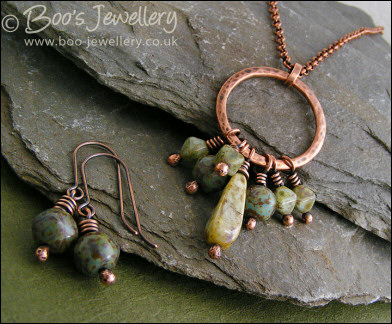 Necklace and earring set featuring a hammered circle wrapped with earthy beads